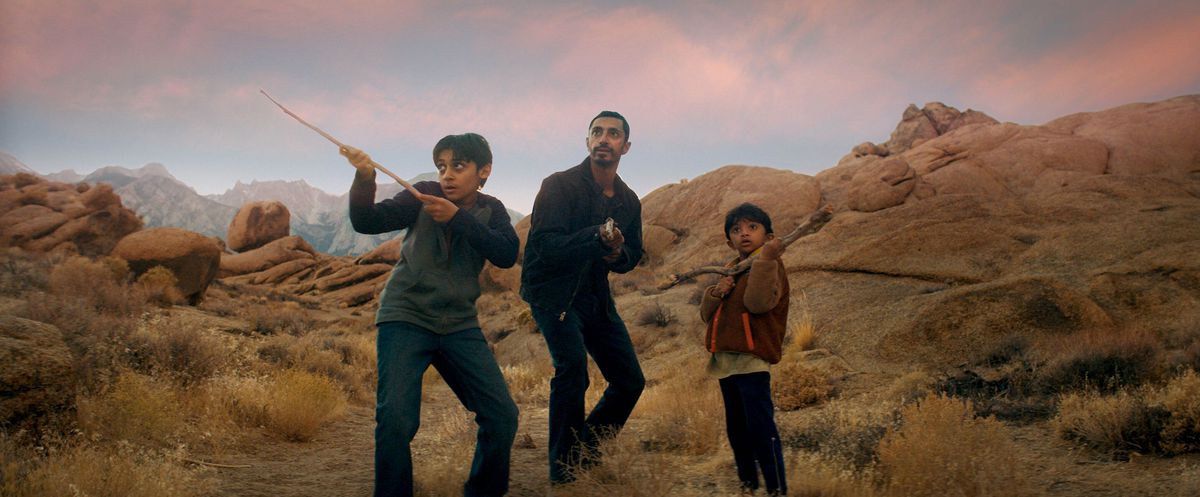 Riz Ahmed and two kids prepare to fight