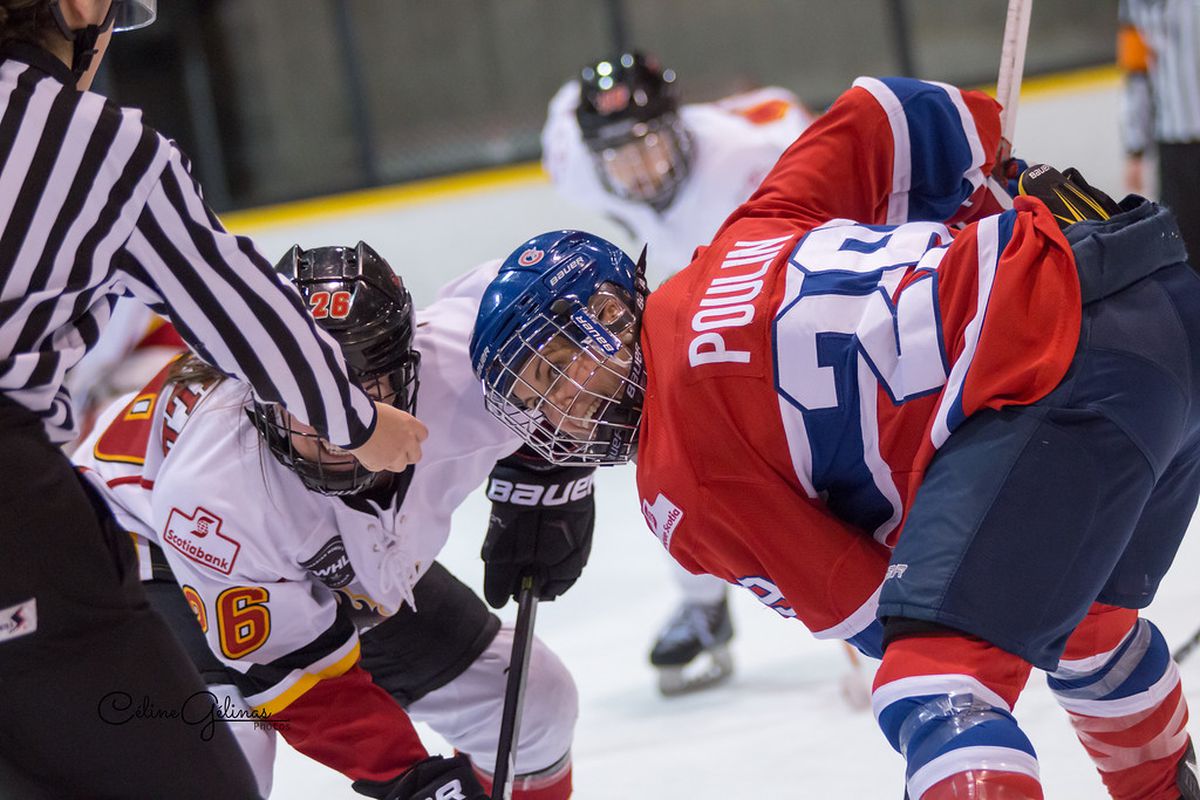 Marie-Philip Poulin of the Canadiennes de Montreal faces off against Calgary Inferno's Blayre Turnbull during the 2016-17 season.