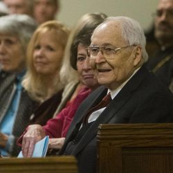 Elder L. Tom Perry smiles as he listens to the East High Madrigal choir. The Very Rev. Raymond J. Waldon, Dean, and the Cathedral Church of St. Mark joins members of the public Sunday, Nov. 30, 2014, in Salt Lake City for an afternoon of lessons and carols.