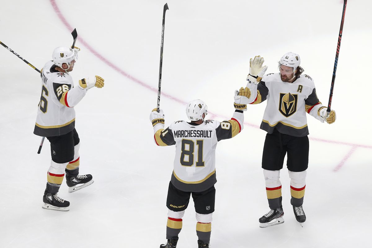 Jonathan Marchessault of the Vegas Golden Knights is congratulated by his teammates, Paul Stastny #26 and Mark Stone #61 after scoring a goal against the Colorado Avalanche during the second period in a Western Conference Round Robin game during the 2020 NHL Stanley Cup Playoff at Rogers Place on August 08, 2020 in Edmonton, Alberta.