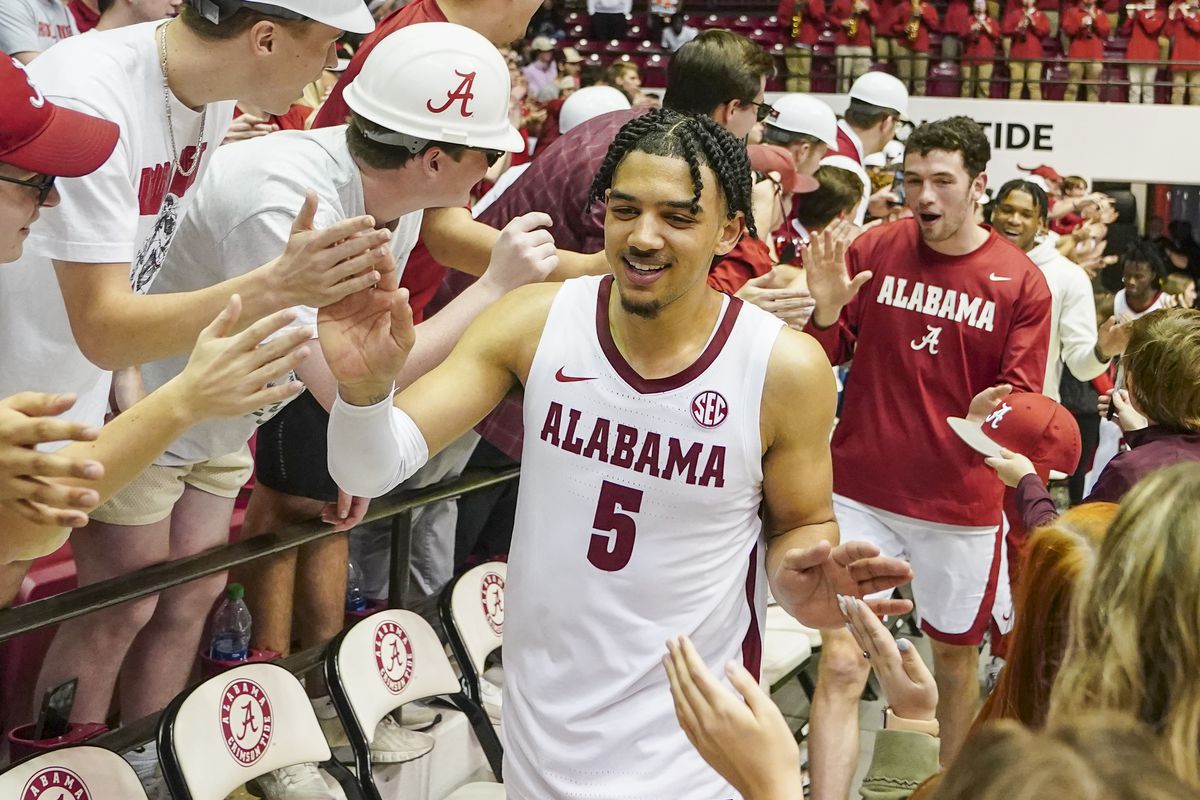 Alabama Crimson Tide guard Jaden Shackelford (5) celebrates with fans after defeating the Mississippi State Bulldogs at Coleman Coliseum.