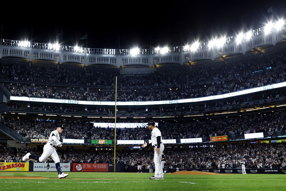 Harrison Bader of the New York Yankees celebrates after hitting a solo home run against Cal Quantrill of the Cleveland Guardians during the third inning in game one of the American League Division Series at Yankee Stadium on October 11, 2022 in New York, New York.
