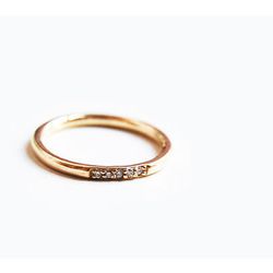 <a href="http://www.shopgiantlion.com/collections/rings-1/products/five-diamond-memory-ring-14k-gold">Five Diamond Memory Ring</a>,  $630 at Giantlion 