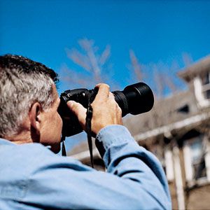 <p>A good way to examine a roof from down below, Tom says, is to use binoculars—or better yet, a camera with a telephoto lens, which you can use to create a lasting record.</p>