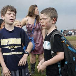 Children wait for their parents to arrive at Briarwood Elementary school after a tornado destroyed the school in south  Oklahoma City, Okla, Monday, May 20, 2013. Near SW 149th and Hudson.  