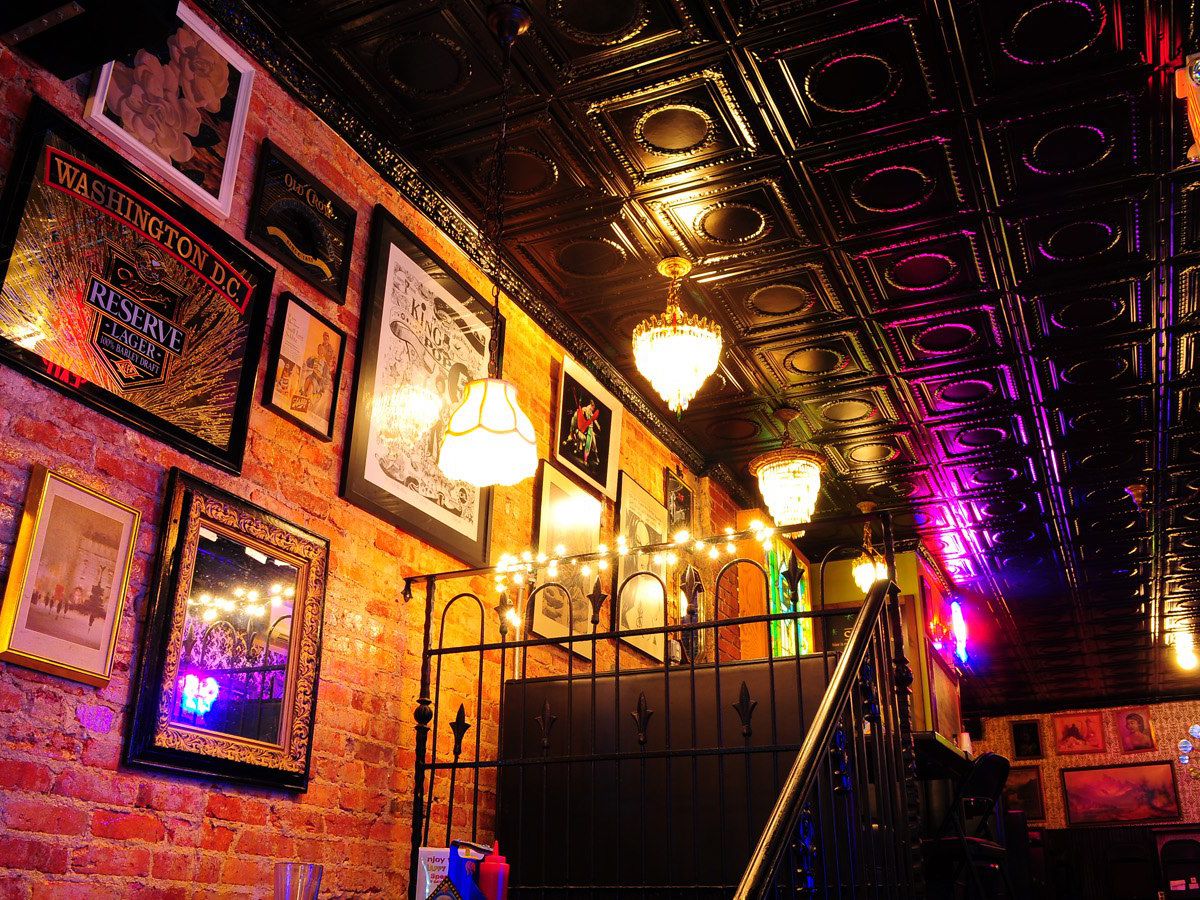 Interior of a bar lined with vintage prints