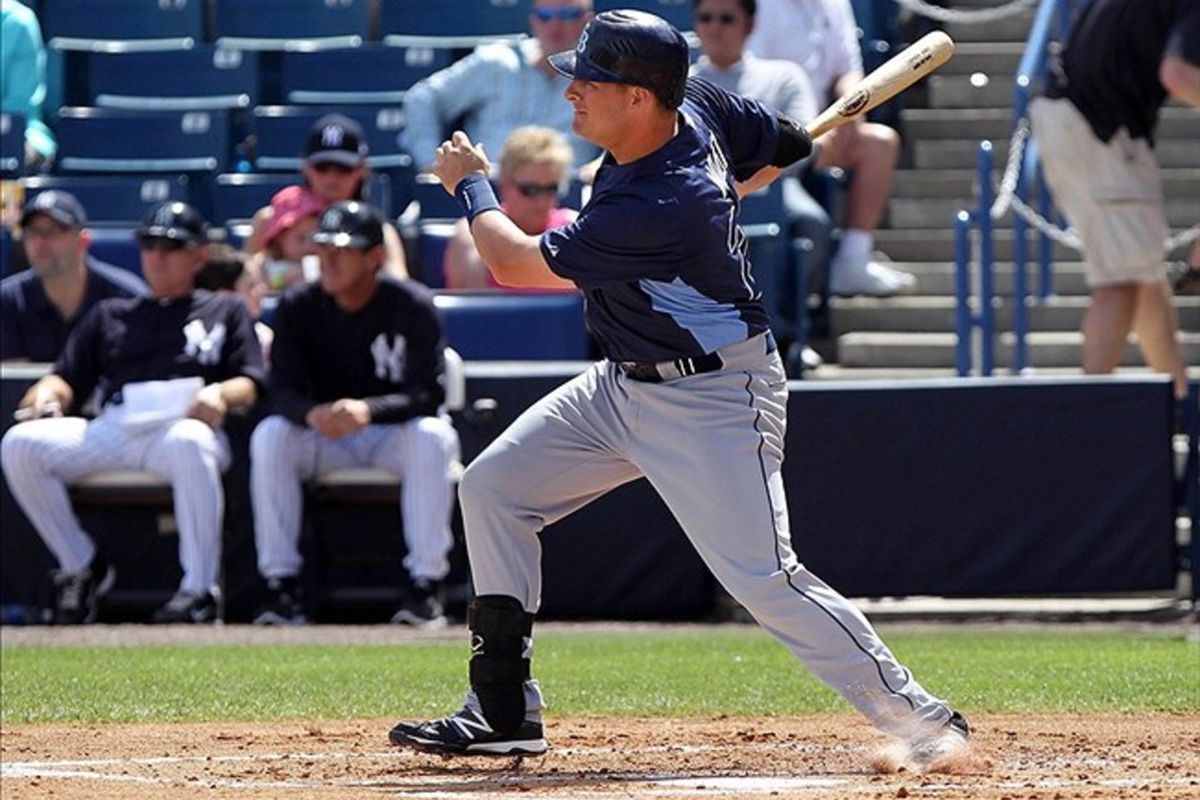 March 7, 2012; Tampa, FL, USA; Tampa Bay Rays catcher Stephen Vogt (26) hits a 2-RBI triple in the second inning against the New York Yankees during spring training at George M. Steinbrenner Field. Mandatory Credit: Kim Klement-US PRESSWIRE