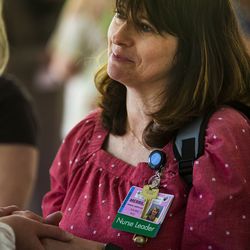 Merrilee Jensen, perinatal safety coordinator at St. Mark's Hospital in Millcreek, smiles after receiving a blessing during the 18th annual Blessing of the Hands at the hospital on Monday, May 13, 2019. The annual ceremony, featuring spiritual leaders from different denominations, recognizes hospital employees for all that they do to promote healing and provide comfort for patients throughout the year.