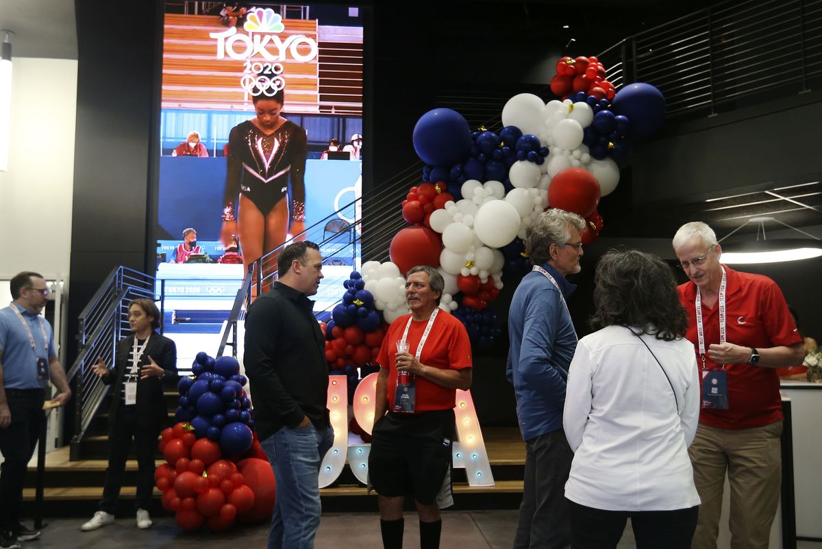 People attend a live immersive watch party for the Olympics at Cosm Experience Center in Salt Lake City on Friday.