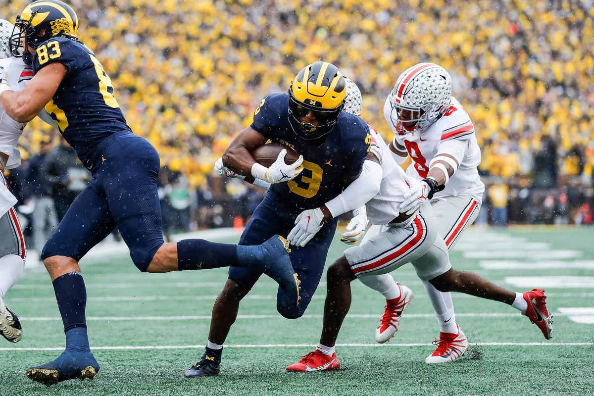 Michigan receiver A.J. Henning runs behind the block of tight end Erick All for a touchdown against Ohio State during the first half at Michigan Stadium in Ann Arbor on Saturday, Nov. 27, 2021.