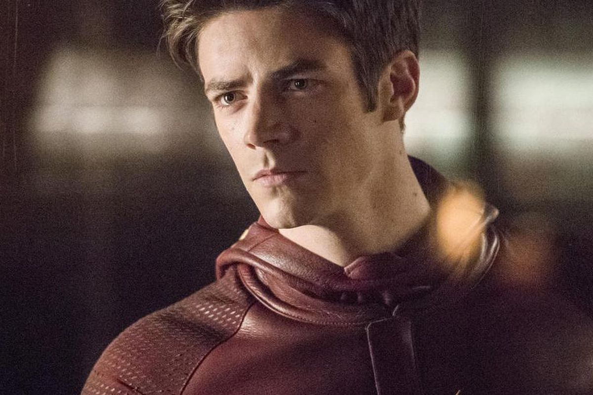 Barry Allen, his Flash mask around his shoulder, looks intensely into the middle distance.