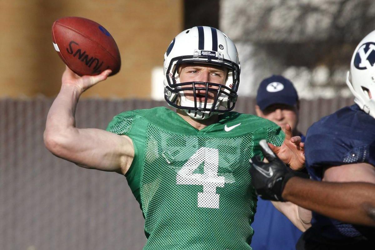 BYU quarterback Taysom Hill throws the ball as the BYU football team practices Monday, March 18, 2013, in Provo.