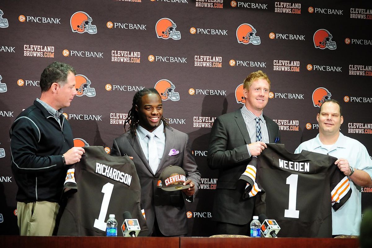 April 27, 2012; Berea, OH, USA; Trent Richardson and Brandon Weeden pose with jerseys at a press conference after being selected in the 2012 NFL Draft at the Cleveland Browns training facility. Mandatory Credit: Andrew Weber-US PRESSWIRE