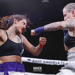 Bec Rawlings lands a left hand on Alma Garcia on Saturday night at Bare Knuckle FC inside Cheyenne Ice & Events Center in Wyoming. 