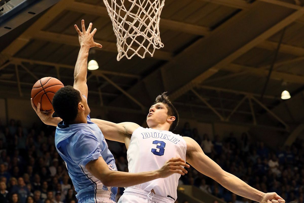 Mar 5, 2016; Durham, NC, USA; Duke Blue Devils guard Grayson Allen (3) drives to the basket against North Carolina Tar Heels guard Marcus Paige (5) in the second half of their game at Cameron Indoor Stadium. 
