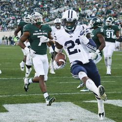 Brigham Young Cougars running back Jamaal Williams (21) scores against the Michigan State Spartans  in East Lansing, MI on Saturday, Oct. 8, 2016. BYU won 31-14.