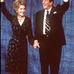 Presiden- elect Ronald Reagan and wife Nancy wave to well-wishers Tuesday night , Nov. 4, 1980, at Century Plaza hotel in Los Angeles after election victory.