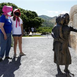 Carolyn Savage Wright of Provo and her granddaughter Scarlett Wright, 12, of Cedar Hills tour the Pioneer Children’s Memorial at This Is The Place Heritage Park in Salt Lake City on Friday, July 24, 2020. Due to the COVID-19, pandemic the annual Days of ’47 parade was canceled, along with other Pioneer Day celebrations.