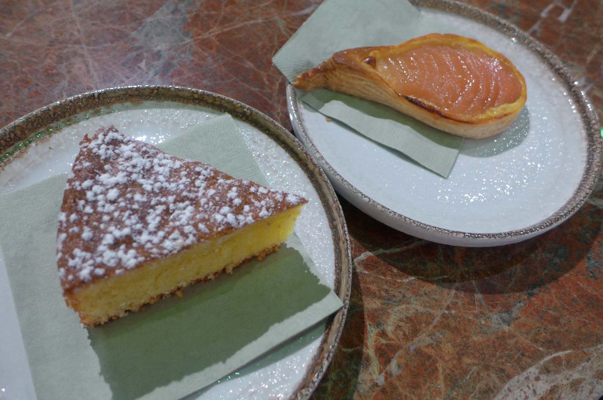 Two pastries on a marble counter.