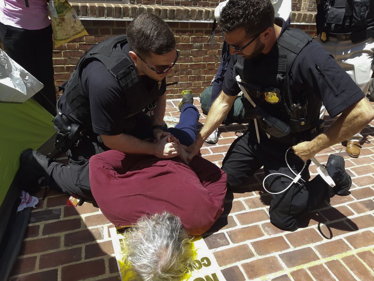 An activist who tried to bring food into the Venezuelan embassy in Washington DC, on May 2, 2019 is arrested.