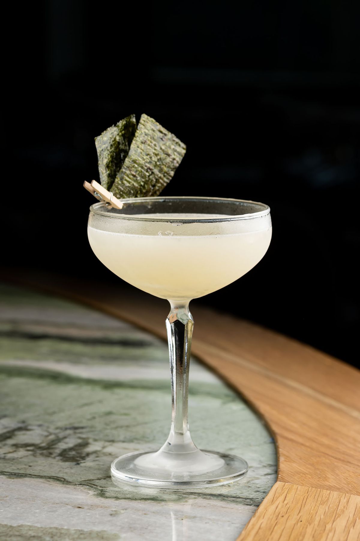A semi-clear martini in a coupe glass.