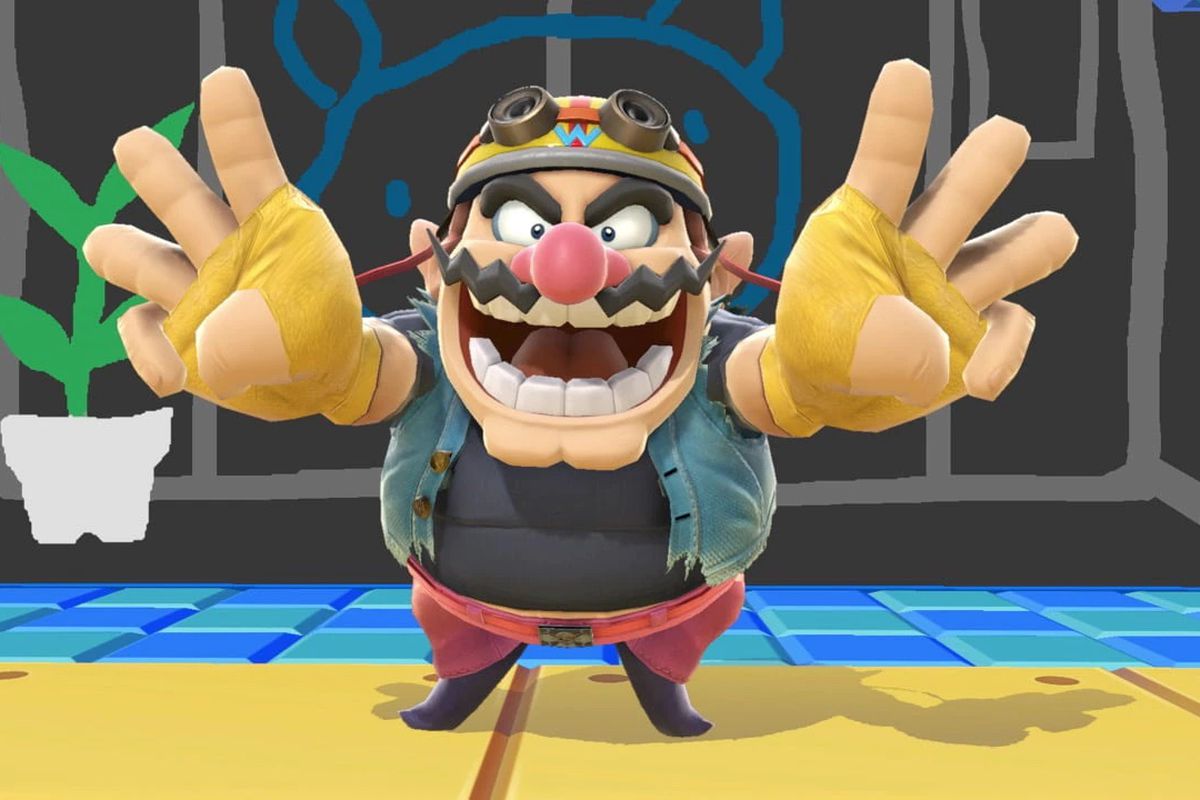 an image of Wario in Super Smash Bros. he’s standing flashing a peace sign but with three fingers up? I don’t know, it’s funny.