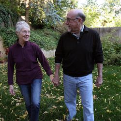 Bill Miller spends time with his wife, Beverly, who has Alzheimer's, in their yard in Salt Lake City, Thursday, Oct. 18, 2012.