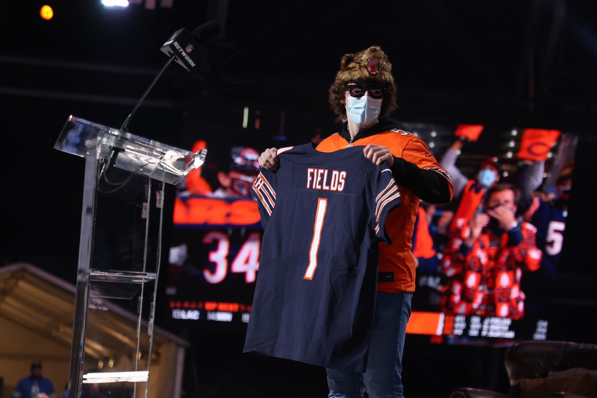 A fan holds a jersey after NFL Commissioner Roger Goodell announced Justin Fields being selected 11th by the Chicago Bears during round one of the 2021 NFL Draft at the Great Lakes Science Center on April 29, 2021 in Cleveland, Ohio.