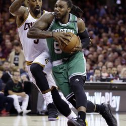 Boston Celtics' Jae Crowder (99) drives on Cleveland Cavaliers' J.R. Smith (5) during the first half of Game 3 of the NBA basketball Eastern Conference finals, Sunday, May 21, 2017, in Cleveland. (AP Photo/Tony Dejak)