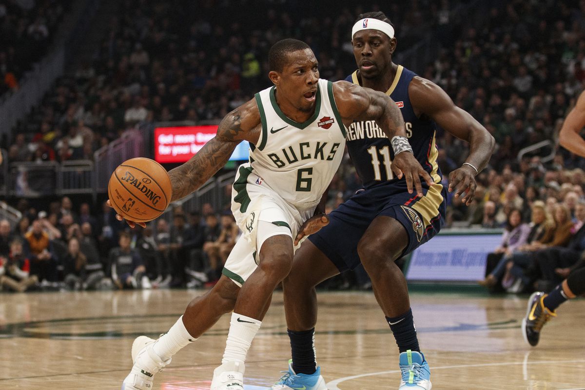 Milwaukee Bucks guard Eric Bledsoe drives for the basket around New Orleans Pelicans guard Jrue Holiday during the second quarter at Fiserv Forum.&nbsp;