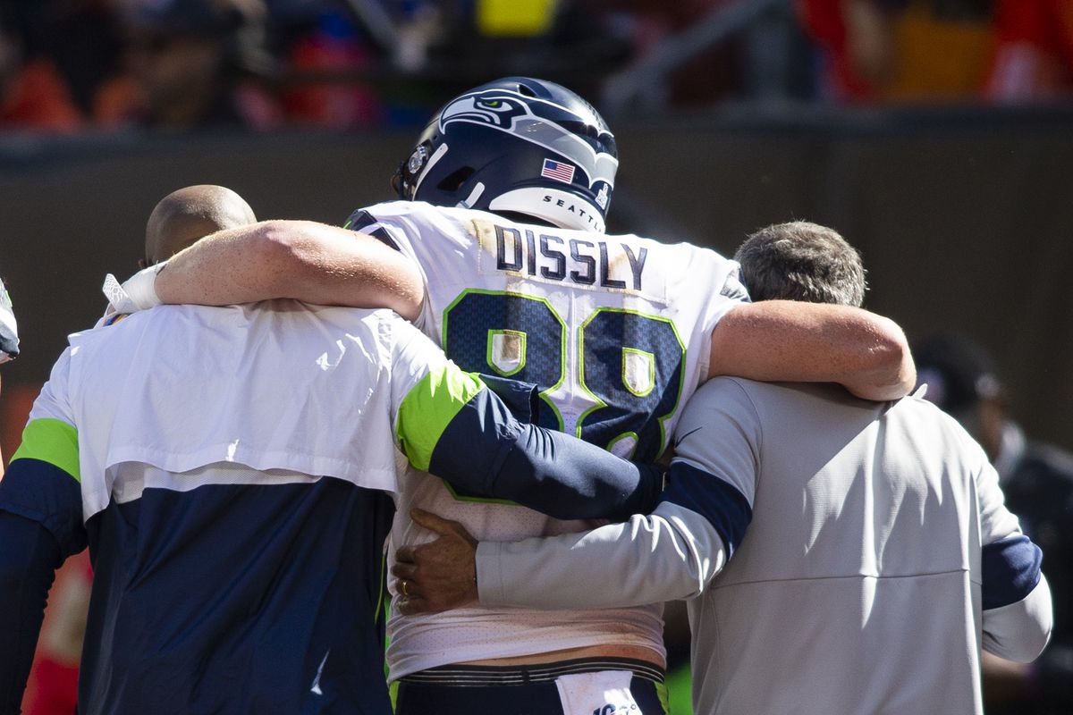 Seattle Seahawks tight end Will Dissly gets help off the field following a foot injury during the second quarter against the Cleveland Browns at FirstEnergy Stadium.