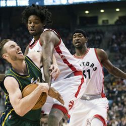 Utah Jazz forward Gordon Hayward (20) tries to move around Toronto Raptors center Lucas Nogueira (92) as Raptors forward Terrence Ross (31) looks on during the first half of an NBA basketball game, Wednesday, March 2, 2016 in Toronto. (Nathan Denette/The Canadian Press via AP) MANDATORY CREDIT