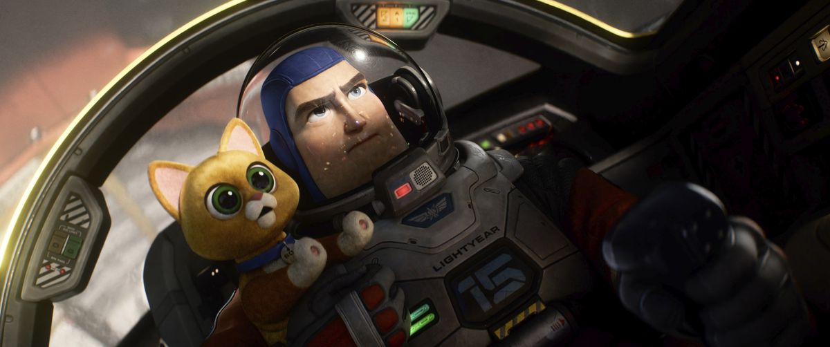 Buzz Lightyear in a cockpit with a cat robot