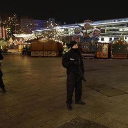 Police guard a Christmas market after a truck ran into the crowded Christmas market in Berliin Berlin, Germany, Monday, Dec. 19, 2016. 