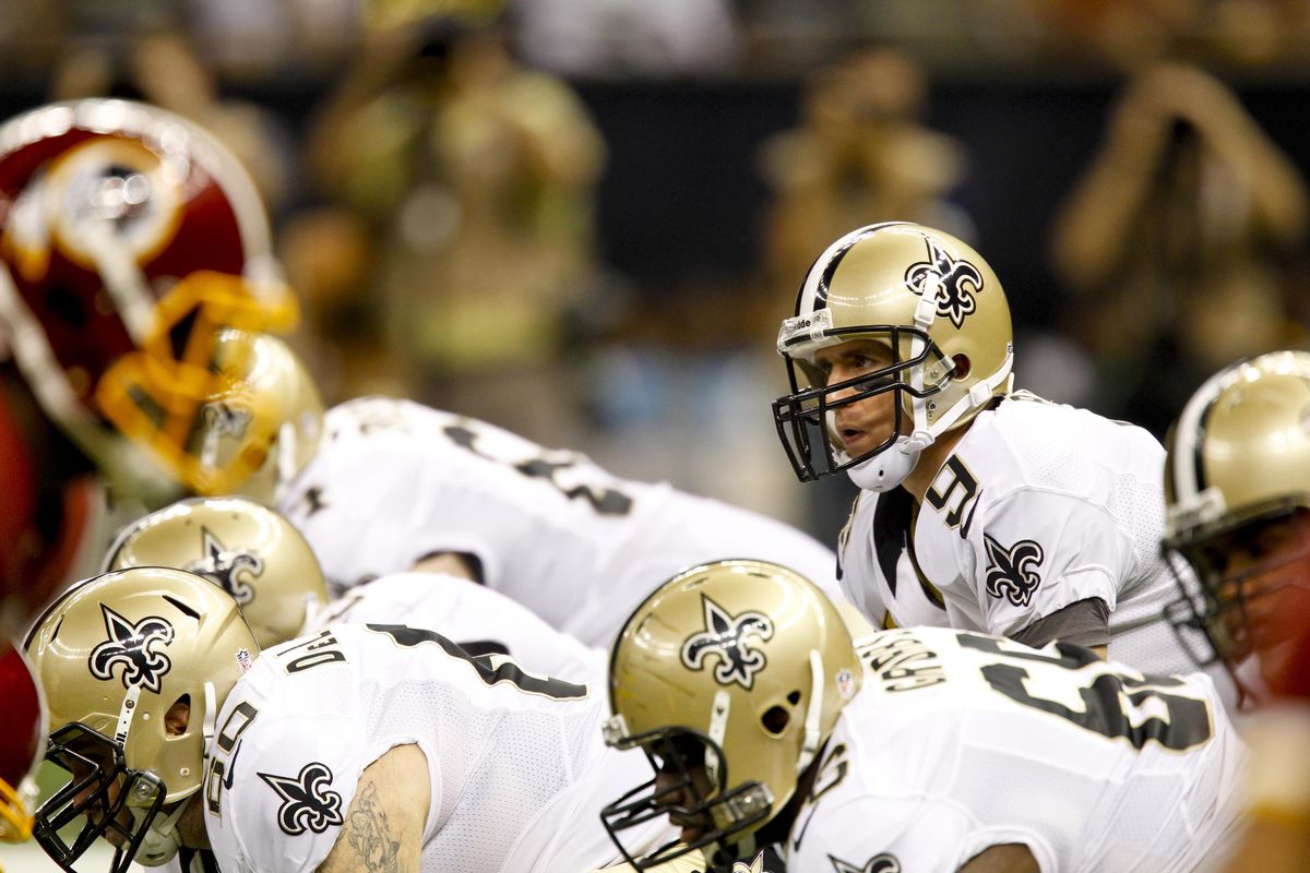September 9, 2012; New Orleans, LA, USA; New Orleans Saints quarterback Drew Brees (9) at the line during the first half of a game against the Washington Redskins at the Mercedes-Benz Superdome. Mandatory Credit: Derick E. Hingle-US PRESSWIRE