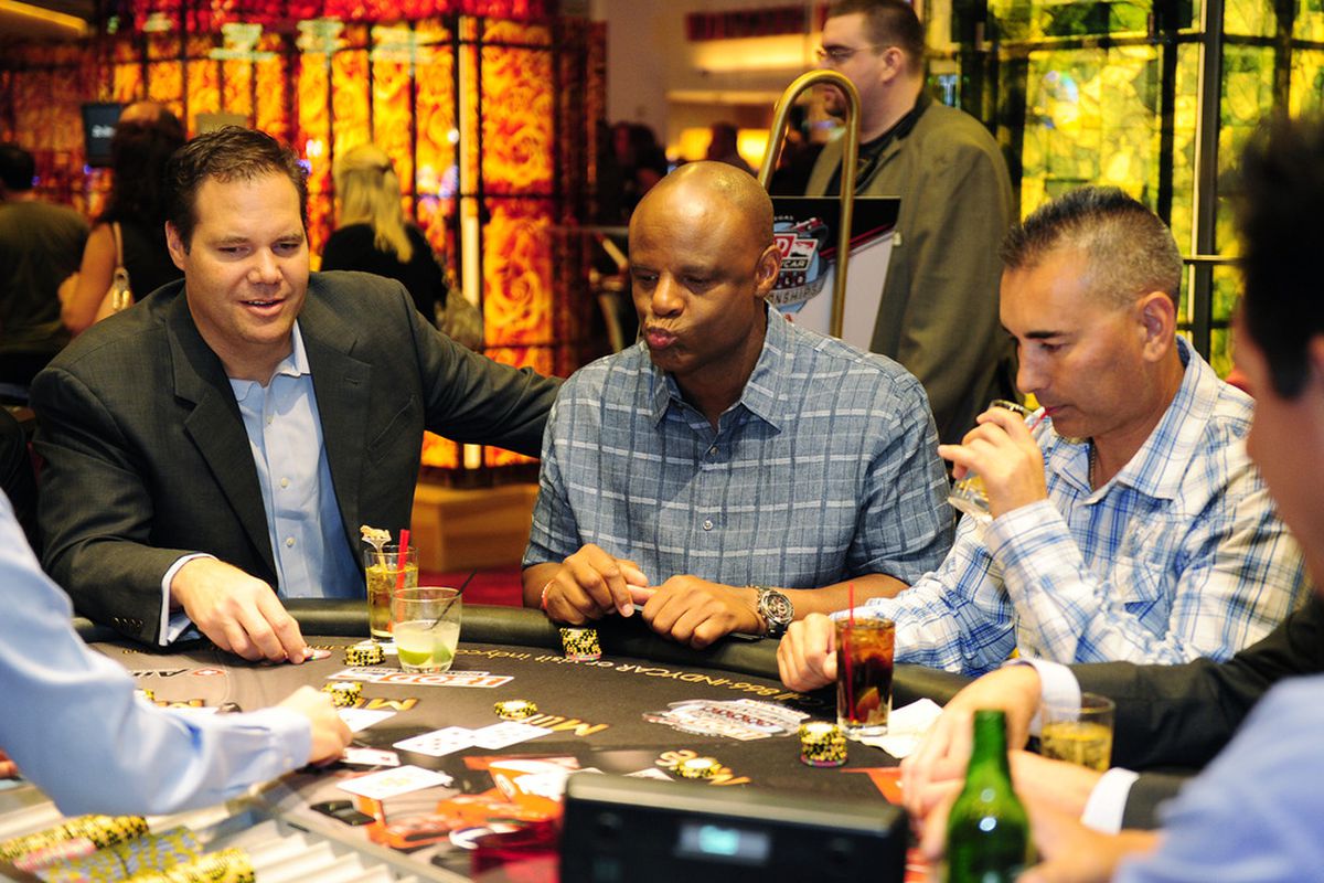LAS VEGAS - OCTOBER 14:  NFL Hall of Famer Warren Moon (center) during the IndyCar Charity Blackjack Tournament presented by AirMed on October 14, 2011 at the MGM Grand in Las Vegas, Nevada.  (Photo by Robert Laberge/Getty Images)