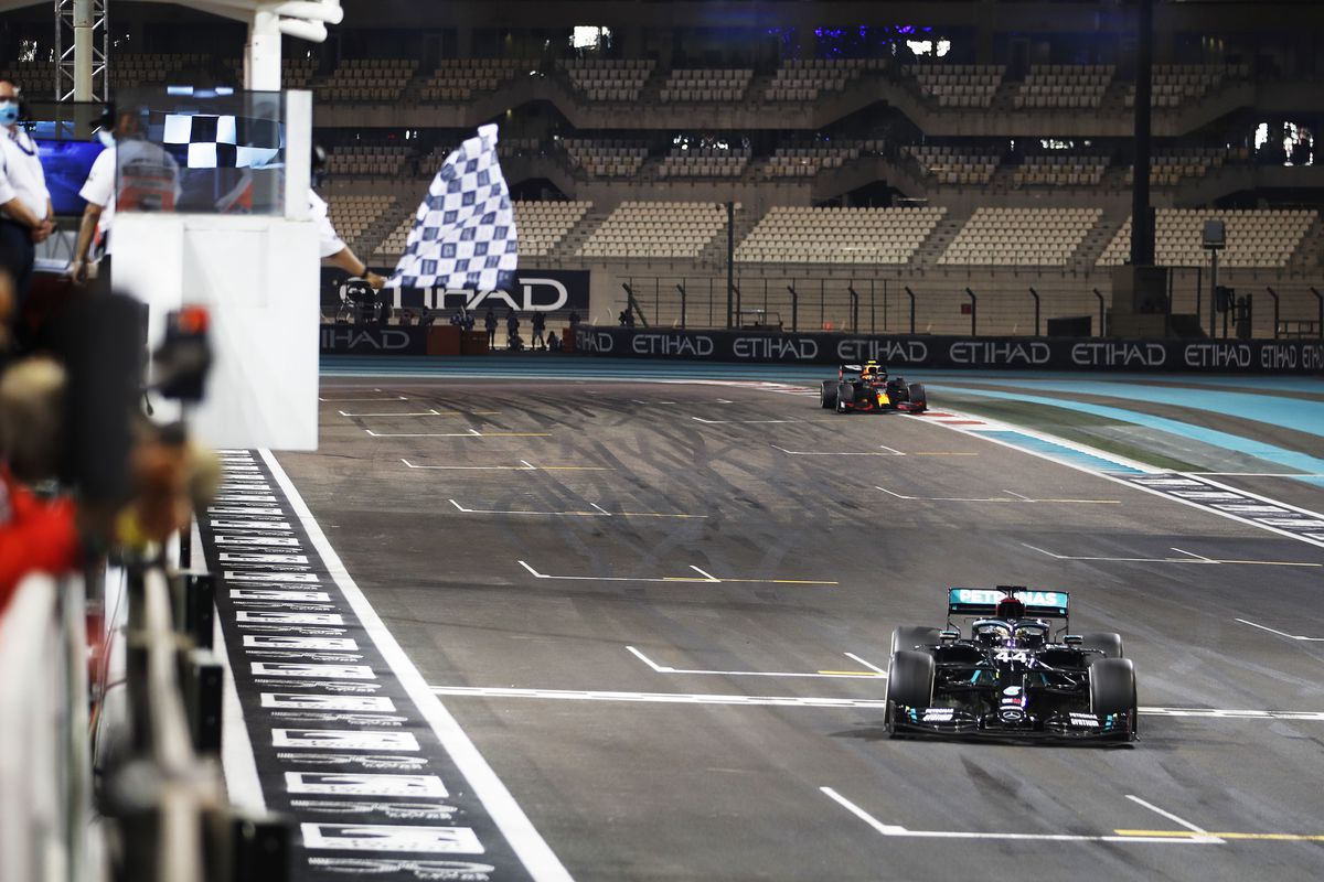 Third placed Lewis Hamilton of Great Britain driving the (44) Mercedes AMG Petronas F1 Team Mercedes W11 passes the chequered flag during the F1 Grand Prix of Abu Dhabi at Yas Marina Circuit on December 13, 2020 in Abu Dhabi, United Arab Emirates.