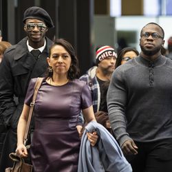 Abimbola, left, and Olabinjo Osundairo walk with their lawyer, Gloria Schmidt, center, into the Leighton Criminal Courthouse, for a hearing for actor Jussie Smollett, Monday morning, Feb. 24, 2020.
