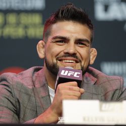 Kelvin Gastelum answers a question at UFC 234 press conference.