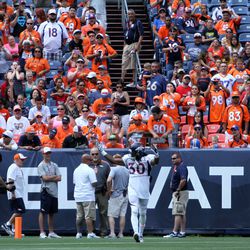 Broncos S David Bruton pumps up the crowd of almost 22,000