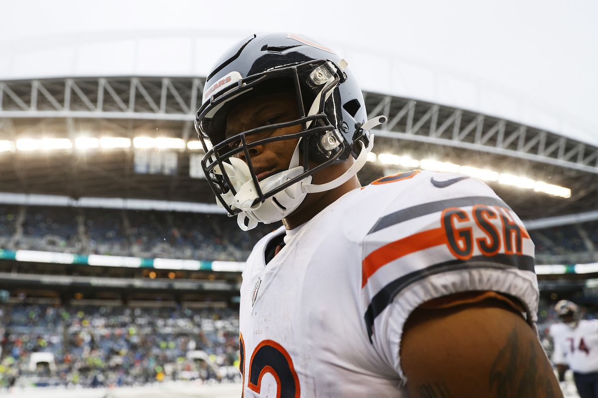 David Montgomery #32 of the Chicago Bears reacts as he runs off the field after the end of the second quarter against the Seattle Seahawks at Lumen Field on December 26, 2021 in Seattle, Washington.