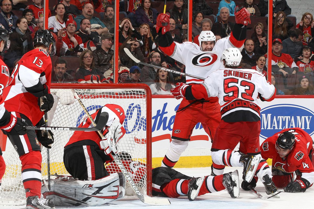Jay Harrison enthusiastically celebrates his overtime game-winner with Jeff Skinner, giving the Hurricanes a 3-2 win Thursday in Ottawa.