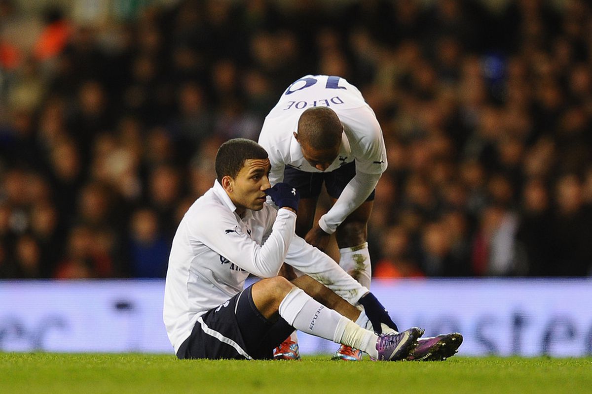 LONDON, ENGLAND - MARCH 07:  Aaron Lennon of Tottenham sits on the turf injured during the FA Cup Fifth Round Replay between Tottenham Hotspur and Stevenage at White Hart Lane on March 7, 2012 in London, England.  (Photo by Mike Hewitt/Getty Images)