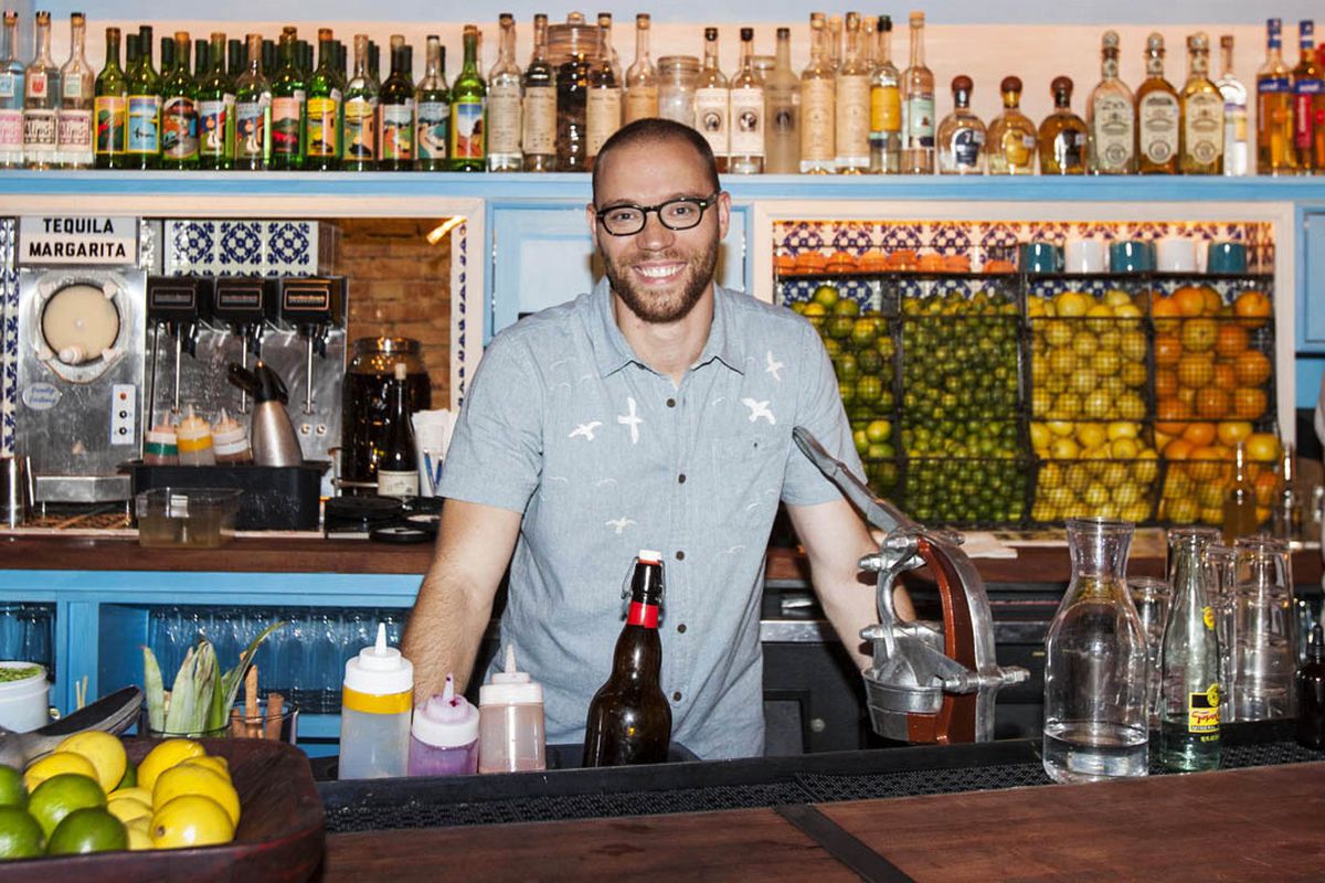 Bobby Heugel behind the bar at his downtown Houston tequila and mescal bar, The Pastry War.