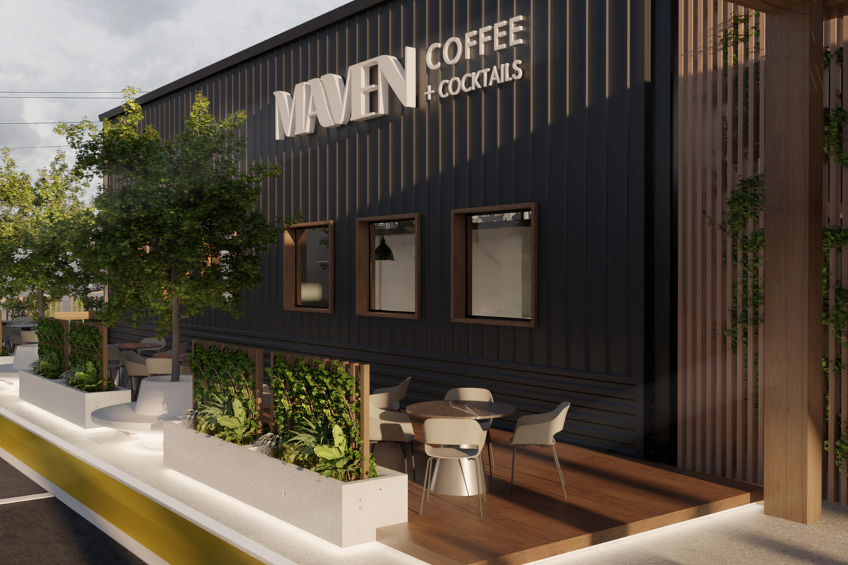 An outside view of Maven Coffee, with outdoor seating and plenty of greenery.