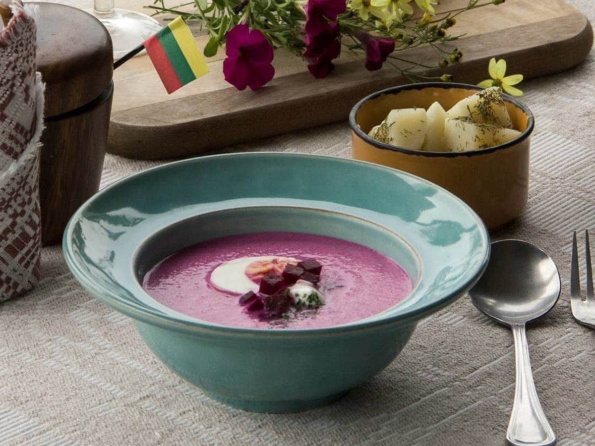 A purple soup, likely borscht.