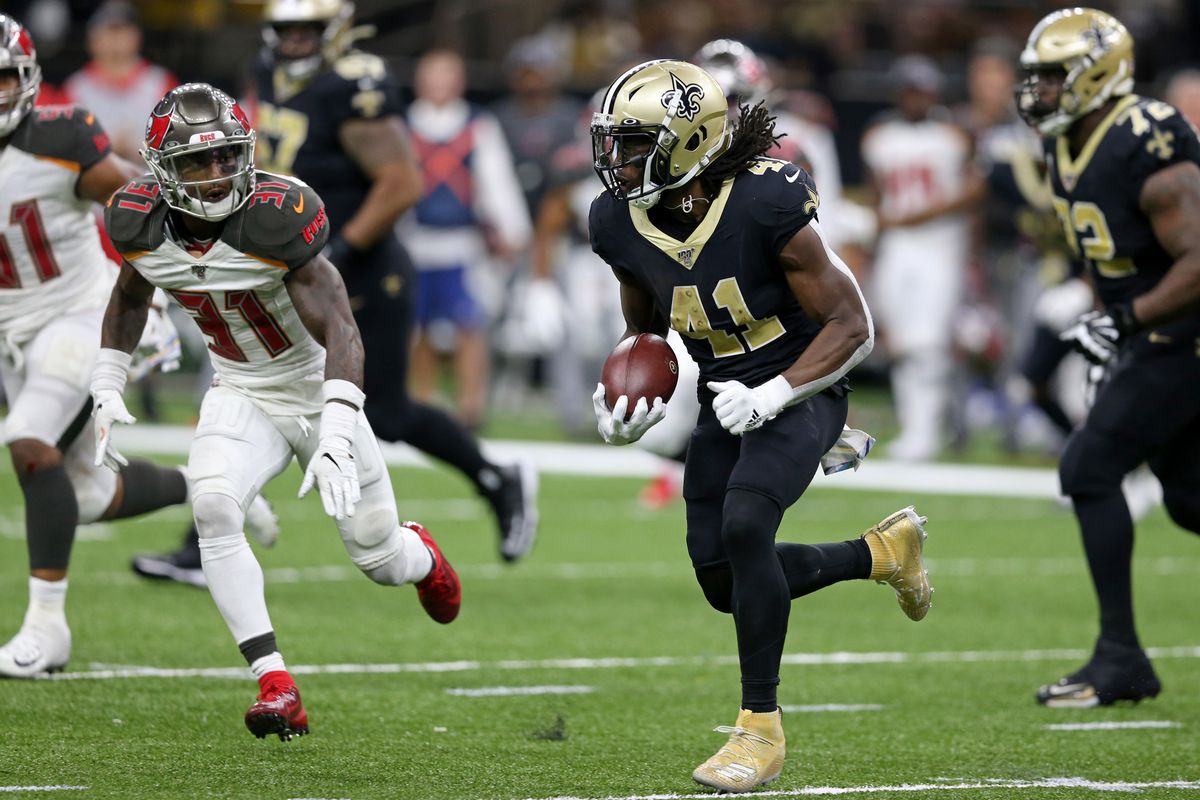 New Orleans Saints running back Alvin Kamara runs the ball against Tampa Bay Buccaneers free safety Jordan Whitehead in the second half at the Mercedes-Benz Superdome.