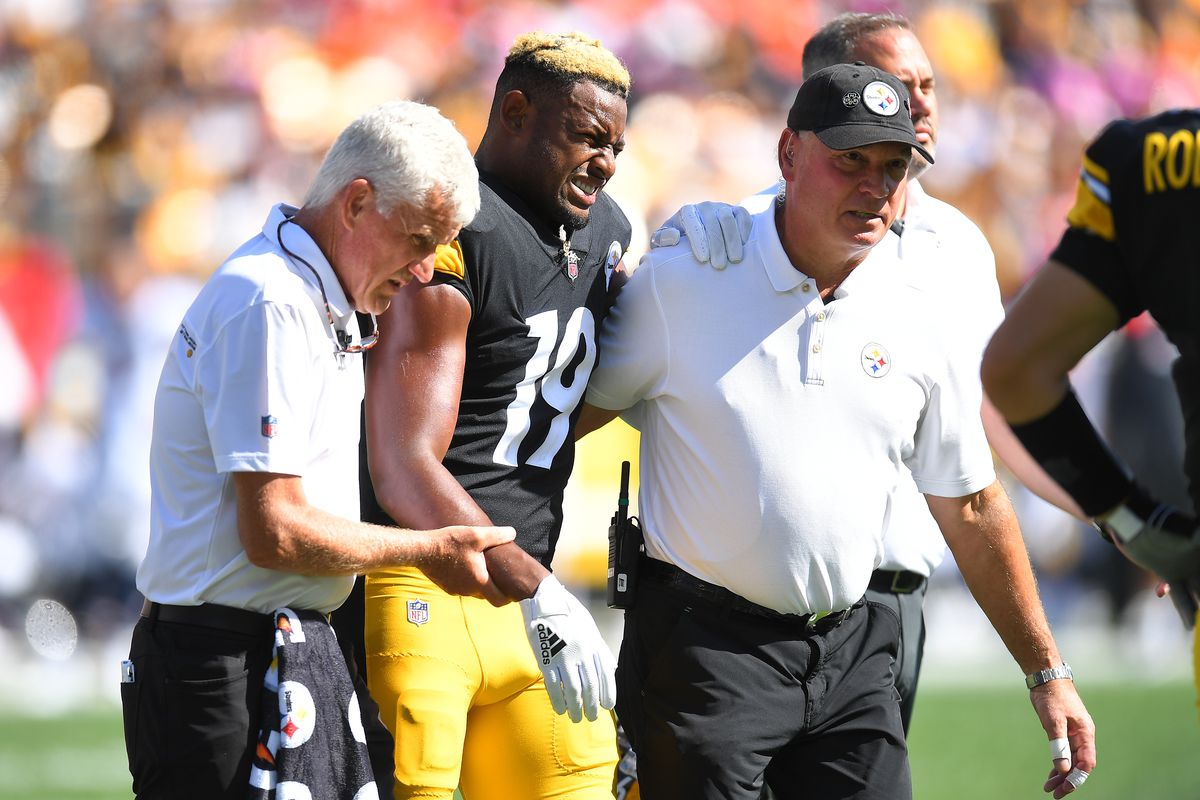JuJu Smith-Schuster #19 of the Pittsburgh Steelers reacts after being injured against the Denver Broncos during the second quarter at Heinz Field on October 10, 2021 in Pittsburgh, Pennsylvania.