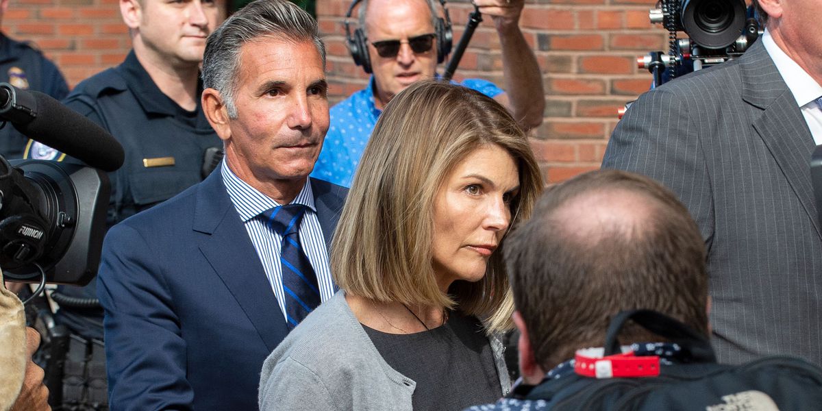 Actress Lori Loughlin reports to prison in college scam