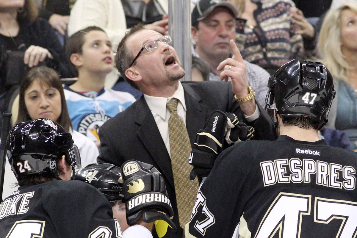 During a Jan. 29 4-1 loss to the Islanders, Dan Bylsma points to the scoreboard to show the battle level disparity.